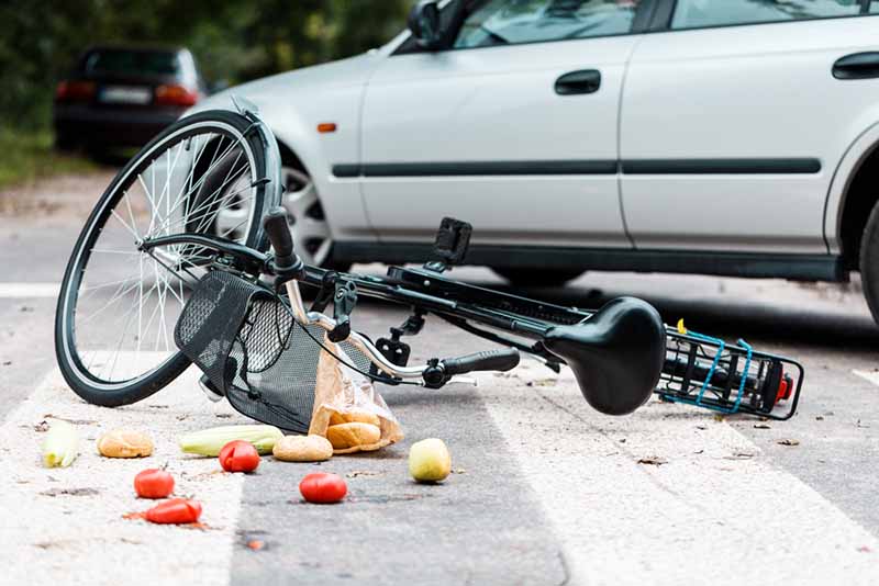 crashed bike on the road after a traffic accident