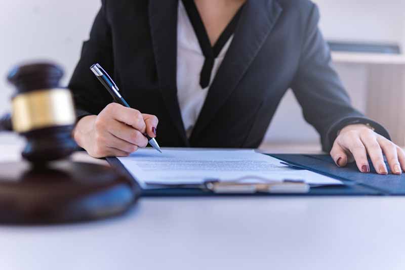 lawyer working, signing papers