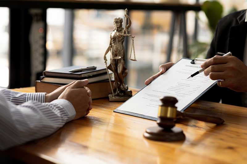 lawyer showing documents to a client