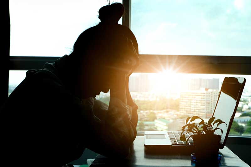 silhouette of a tired woman